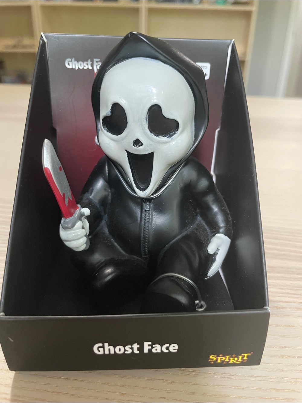 Spirit Ghost Face Figure in Black and White with Red-Accented Knife